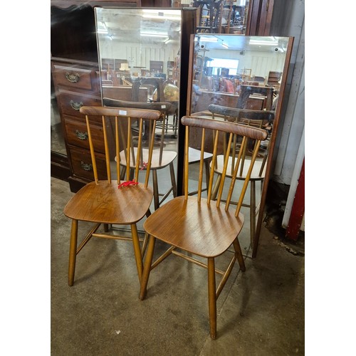 120 - A pair of teak Danish Billund Stolefabrik beech kitchen chairs and two teak framed mirrors