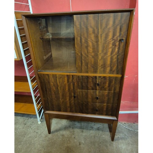 28 - An afromosia side cabinet