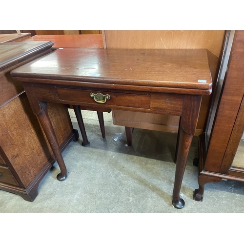 203 - A George II mahogany fold over tea table