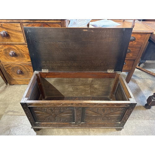 252 - A 17th Century style carved oak blanket box