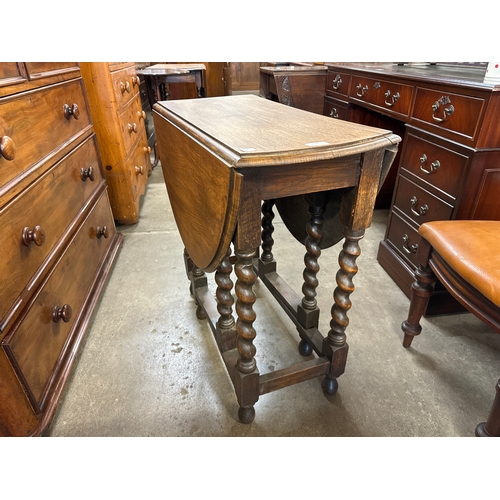 219 - An early 20th Century oak barleytwist gateleg table