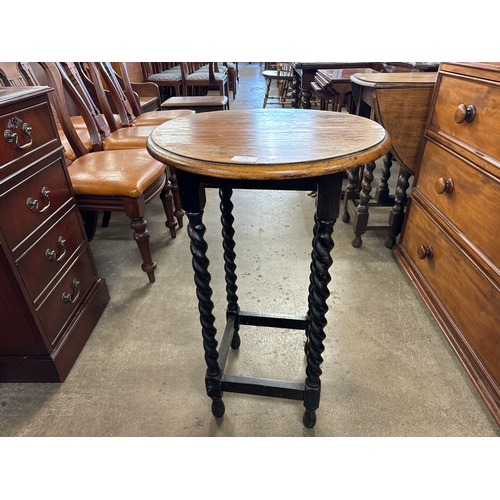 221 - An early 20th Century oak barleytwist circular occasional table