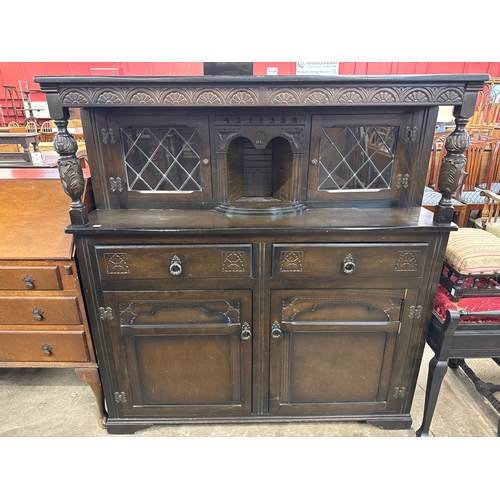 234 - A carved oak court cupboard