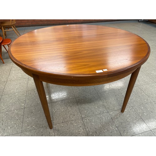 24 - A G-Plan Fresco teak circular extending dining table