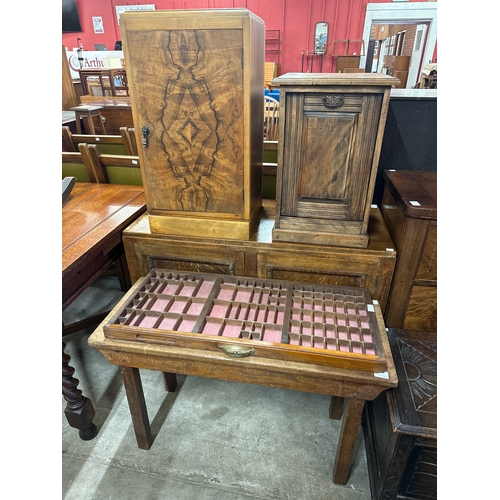 246 - A carved oak cupboard, two pot cupboards, coffee table and a printers tray