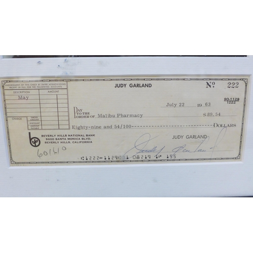 607 - A Judy Garland signed cheque and photograph display with Rutland Autographs AFTAL registered C.O.A.