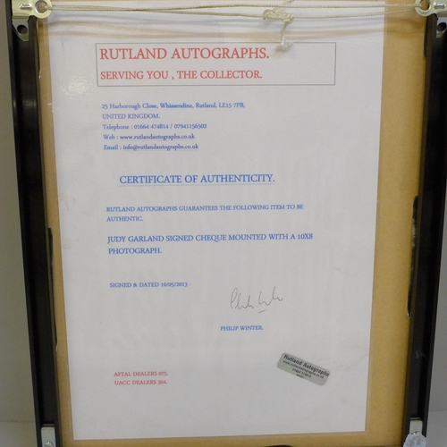 607 - A Judy Garland signed cheque and photograph display with Rutland Autographs AFTAL registered C.O.A.