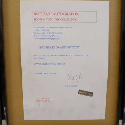 608 - A David Niven signed cheque and photograph display with Rutland Autographs AFTAL registered C.O.A.