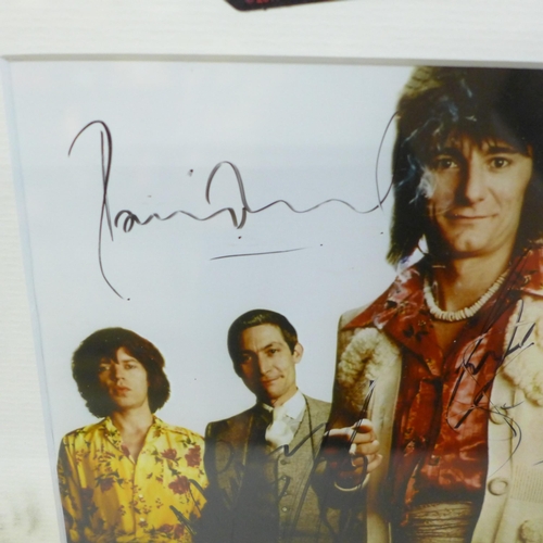 615 - Rolling Stones; Mick Jagger, Ronnie Wood, Keith Richards and Charlie Watts signed photograph with a ... 