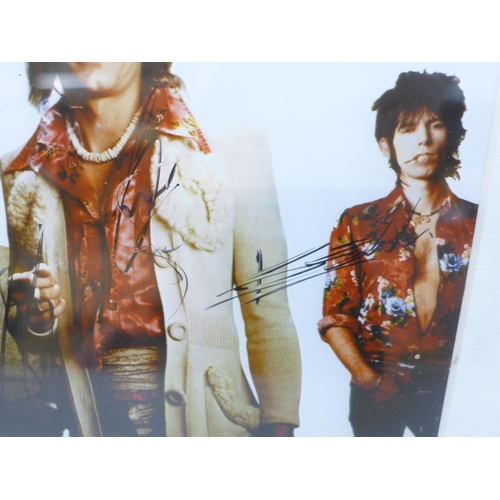 615 - Rolling Stones; Mick Jagger, Ronnie Wood, Keith Richards and Charlie Watts signed photograph with a ... 