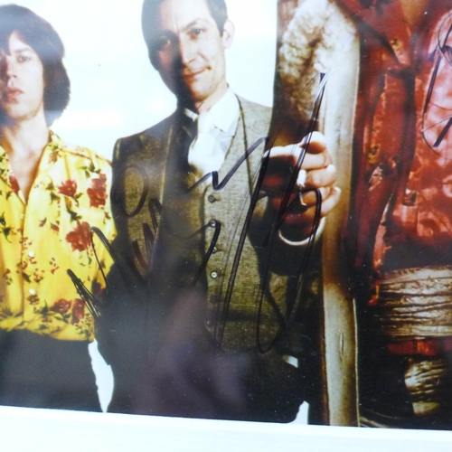 615 - Rolling Stones; Mick Jagger, Ronnie Wood, Keith Richards and Charlie Watts signed photograph with a ... 