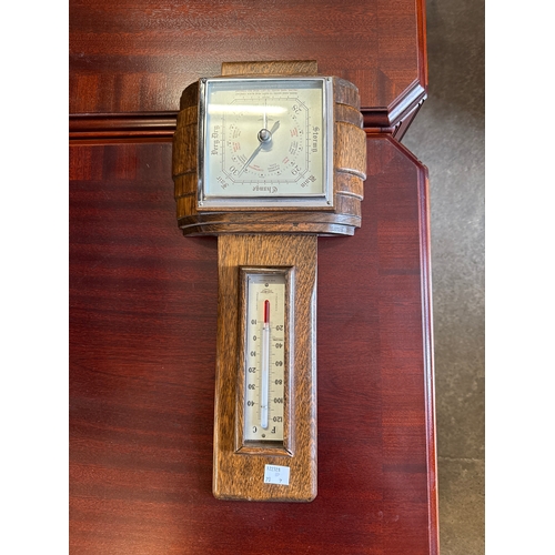 250 - An Edward VII mahogany piano stool and barometer