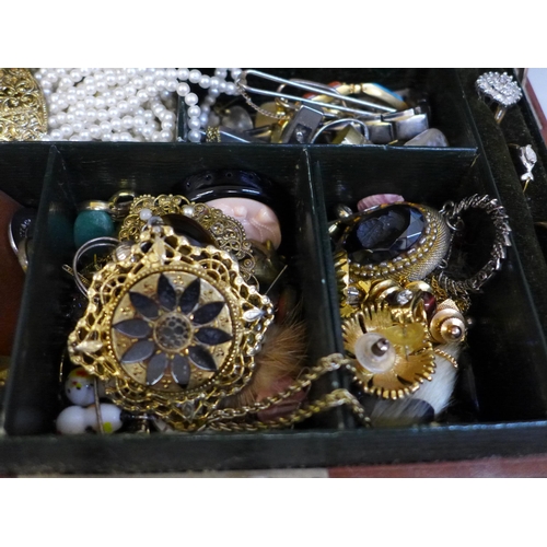 640 - A leather case of costume jewellery