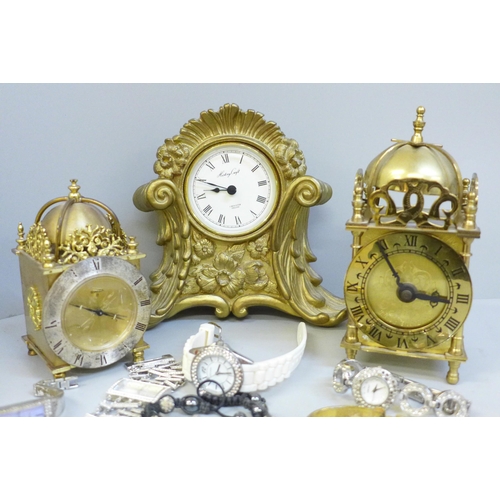 649 - Three clocks including Swiss and a collection of wristwatches including DKNY (a/f missing stones)