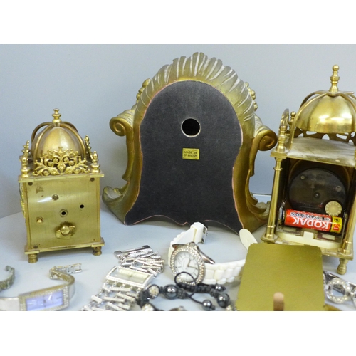 649 - Three clocks including Swiss and a collection of wristwatches including DKNY (a/f missing stones)