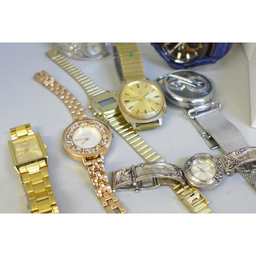 661 - Lady's and gentleman's wristwatches including one with silver bangle strap and a boxed Smart watch