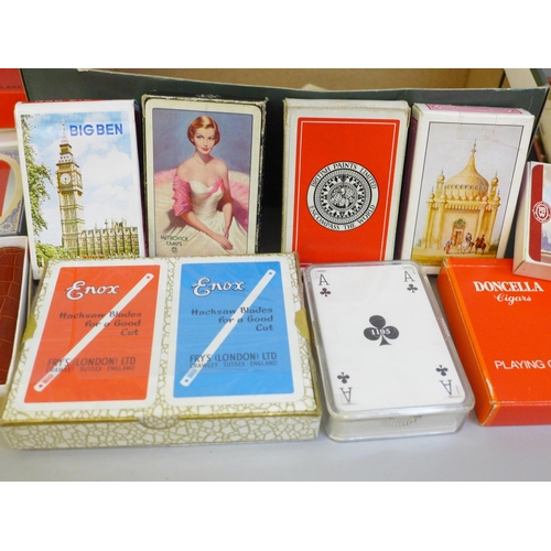 662 - A leather cased Bridge set and a collection of playing cards (some unused)