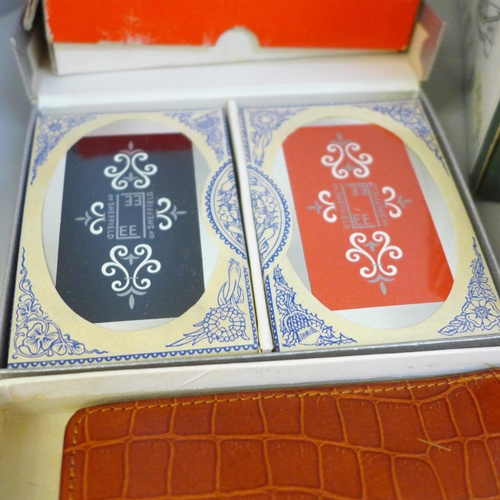 662 - A leather cased Bridge set and a collection of playing cards (some unused)