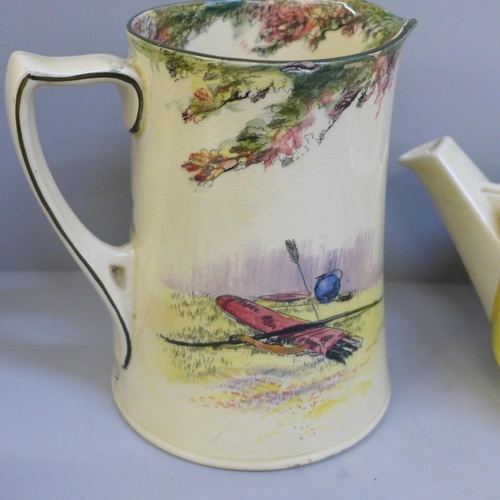 676 - Two Royal Doulton Robin Hood Series Ware jugs, one jug with hairline crack and a teapot