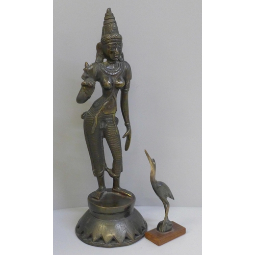 677 - A bronze model of an Indian Goddess, Parvati Devi and a horn and rosewood model of a bird