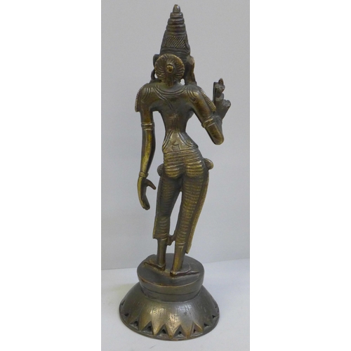 677 - A bronze model of an Indian Goddess, Parvati Devi and a horn and rosewood model of a bird