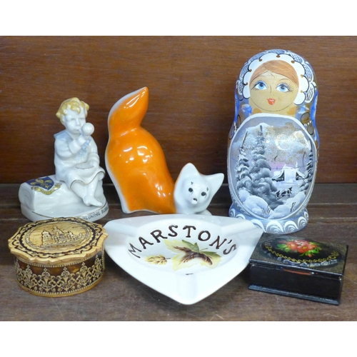 682 - A Moorcroft Marston's Ales ashtray, a Russian doll, model of a fox, lacquered box, one other box and... 