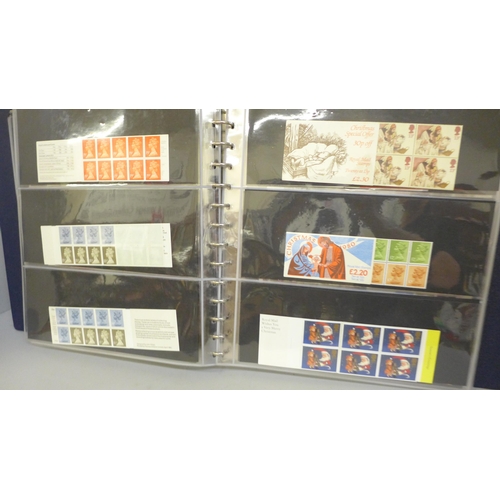 687 - Stamps; an album of GB booklets including £1 Wedgwood and booklet panes on first day covers, face va... 