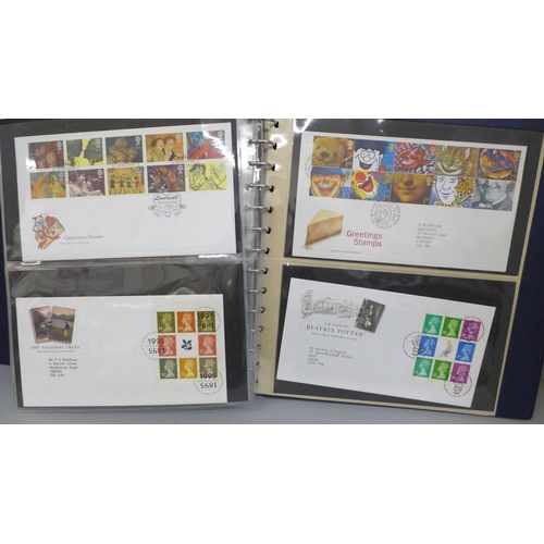 687 - Stamps; an album of GB booklets including £1 Wedgwood and booklet panes on first day covers, face va... 