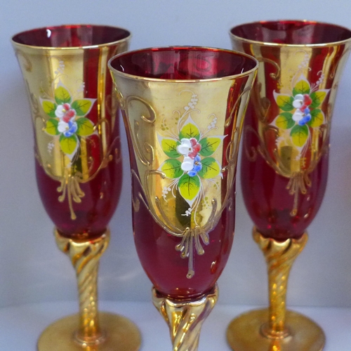 690 - A set of six Bohemian ruby glass and gold wines