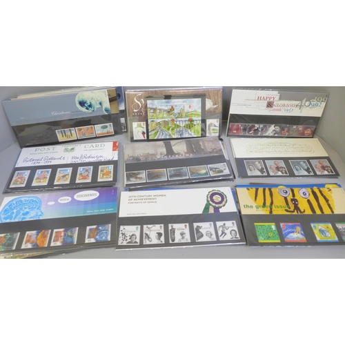 691 - A collection of 56 Royal Mail mint stamp packs