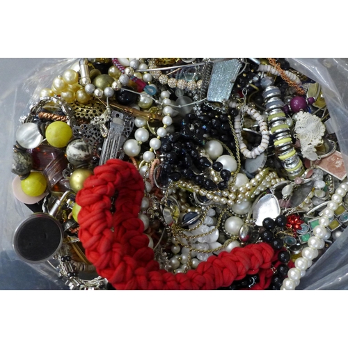 702A - A large bag of costume jewellery, approx 8kg