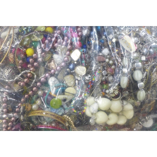 711A - A large bag of costume jewellery, approx 8kg