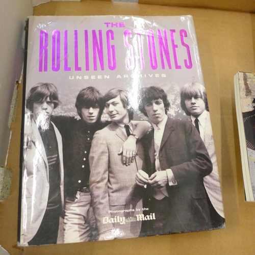 712 - A box of Rolling Stones books and DVDs and a 'Get Yer Ya-Ya's Out' CD and DVD box set