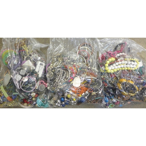 717 - Three large bags of costume jewellery