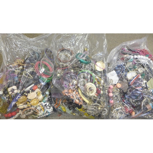 717 - Three large bags of costume jewellery