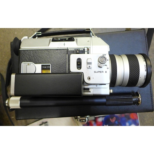 721 - A Canon A-1 35mm SLR camera body, a Canon cine camera, cased and a cleaning kit