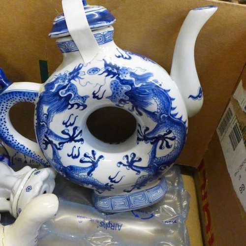 725 - Mixed blue and white oriental style china, including a toroidal teapot with four character mark to b... 