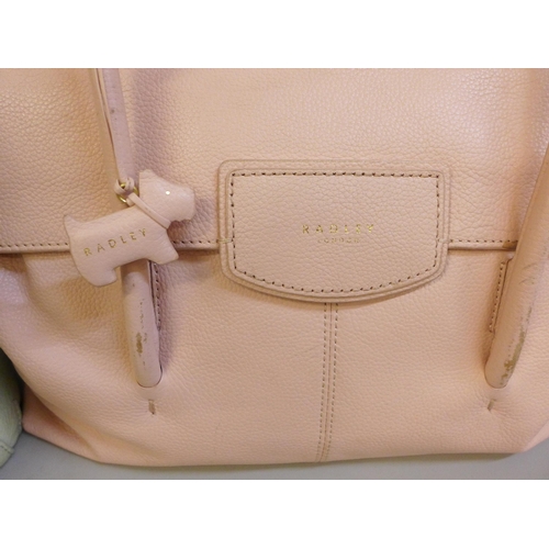 727 - Two Radley pink and pistachio handbags, both with dust bags