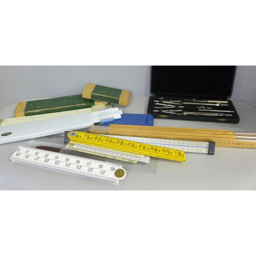 734 - A Lee Guinness technical drawing set, slide rules and rulers, etc.