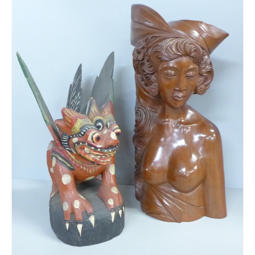 744 - A carved wooden bust of a South East Asian girl and a Chinese painted carving of a dragon