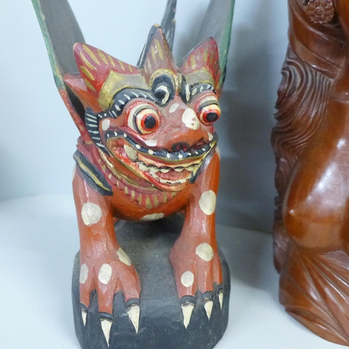 744 - A carved wooden bust of a South East Asian girl and a Chinese painted carving of a dragon