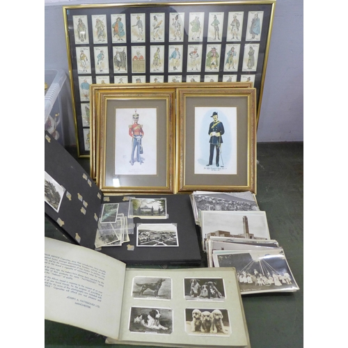 752 - A box of mixed postcards, two albums of cigarette cards and photographs, framed prints of soldiers a... 