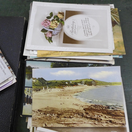 752 - A box of mixed postcards, two albums of cigarette cards and photographs, framed prints of soldiers a... 