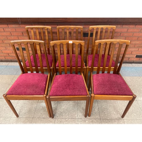 41 - A set of six teak dining chairs