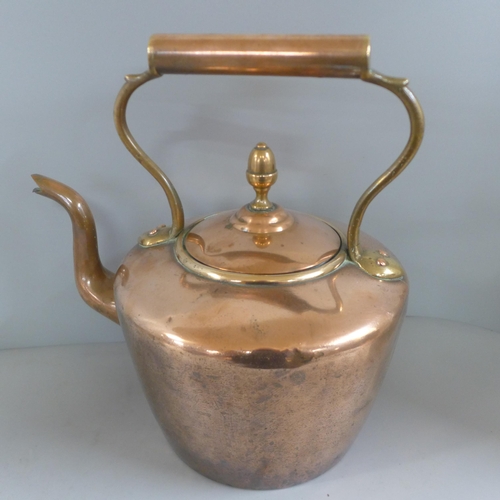 772 - A Victorian copper kettle and a brass trivet