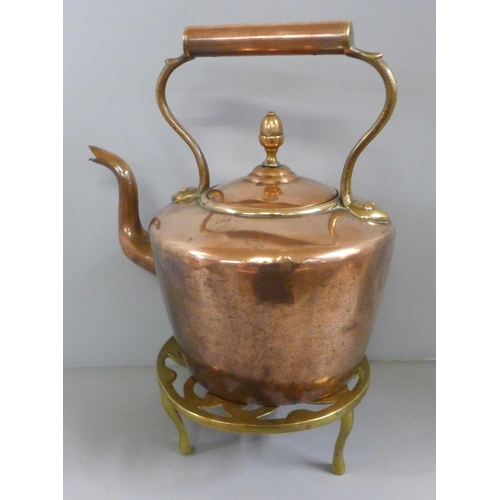 772 - A Victorian copper kettle and a brass trivet