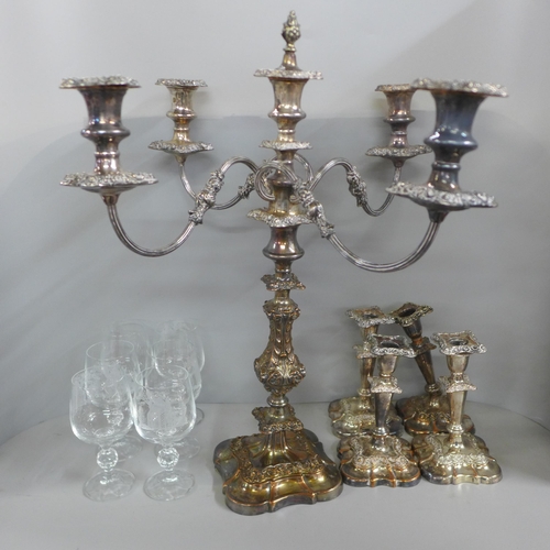 773 - A silver plate on copper tall candelabra with two pairs of candlesticks, one a/f and a set of six et... 