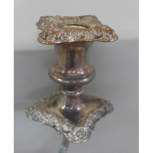 773 - A silver plate on copper tall candelabra with two pairs of candlesticks, one a/f and a set of six et... 