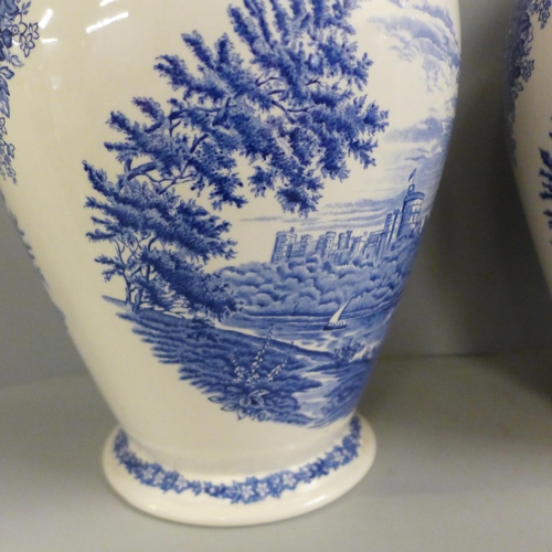 780 - A pair of Wedgwood Windsor Castle blue and white vases, 32cm