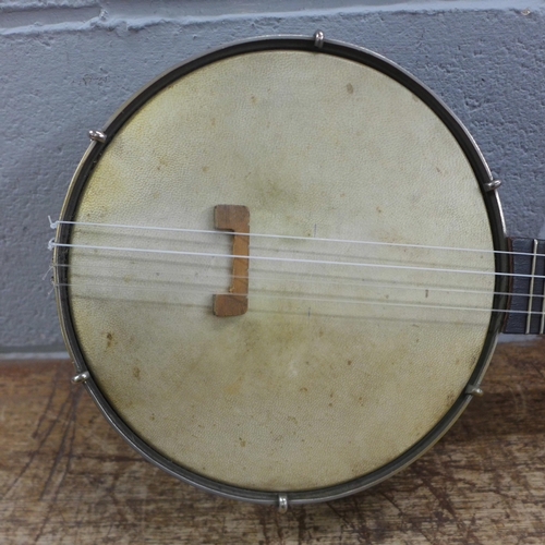 784 - A cased banjo, marked Keech, with four George Formby EPs